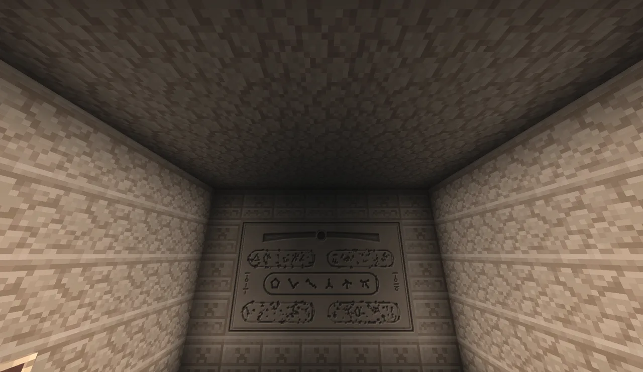 A carved slab with a winged sun and rows of cartouches of gate addresses